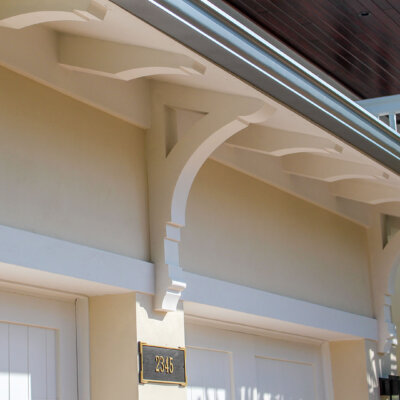 Home design Soffit system comprised of rafter tails, fascia board, and pvc brackets made by hardie boys inc.