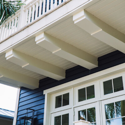 exposed pvc rafter tails on a soffit ceiling.