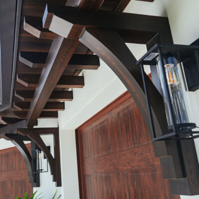 wooden brackets and wooden rafter tails above garage by hardie boys inc