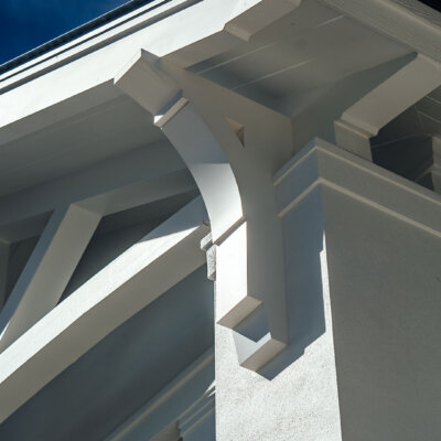 Soffit system comprised of rafter tails, fascia board, and pvc brackets made by hardie boys inc