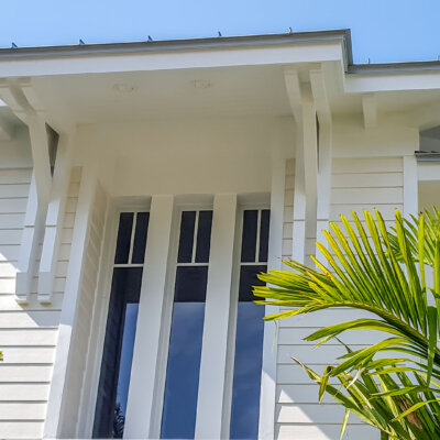 Soffit system comprised of rafter tails, fascia board, and pvc brackets made by hardie boys inc