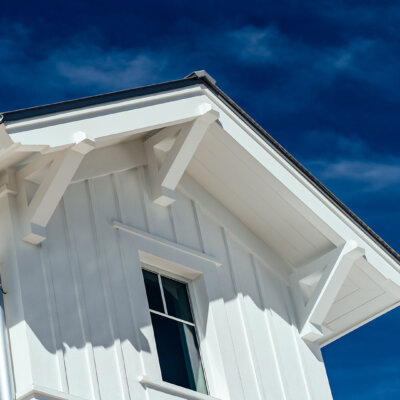 Soffit system comprised of rafter tails, fascia board, and pvc brackets made by hardie boys inc
