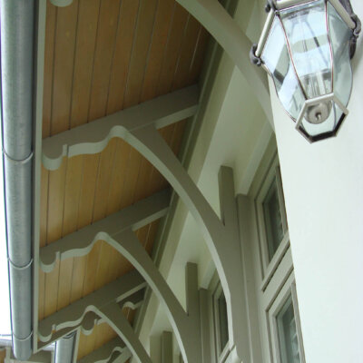 Soffit system comprised of rafter tails, fascia board, and pvc brackets made by hardie boys inc