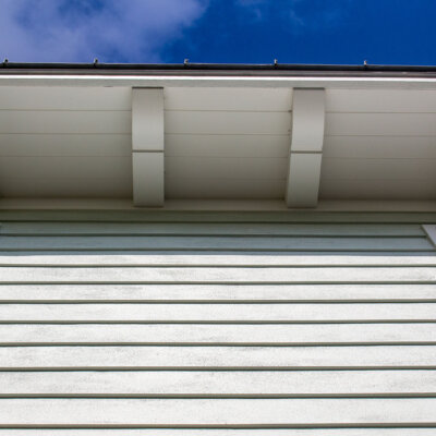 Home design Soffit system comprised of rafter tails, fascia board, and pvc brackets made by hardie boys inc.