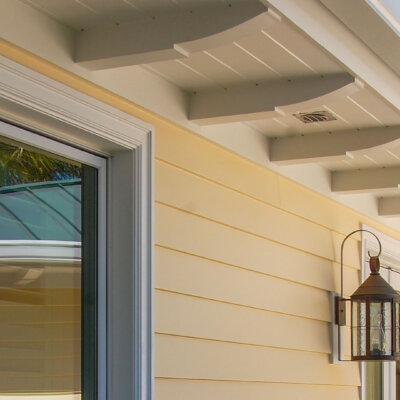 Home design Soffit system comprised of rafter tails, fascia board, and pvc brackets made by hardie boys inc.