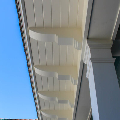 Home design Soffit system comprised of rafter tails, fascia board, and pvc brackets made by hardie boys inc.