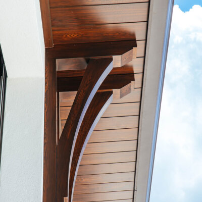 Home design Soffit system comprised of rafter tails, fascia board, and pvc brackets made by hardie boys inc.