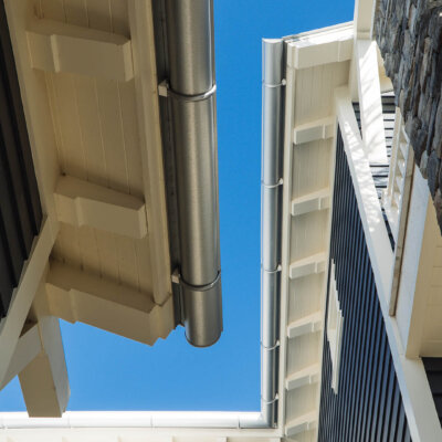 Home design Soffit system comprised of rafter tails, fascia board, and pvc brackets made by hardie boys inc.