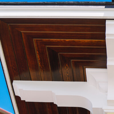 Home design Soffit system comprised of rafter tails, fascia board, and pvc brackets made by hardie boys inc.