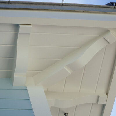 Home design Soffit system comprised of rafter tails, fascia board, and pvc brackets made by hardie boys inc.