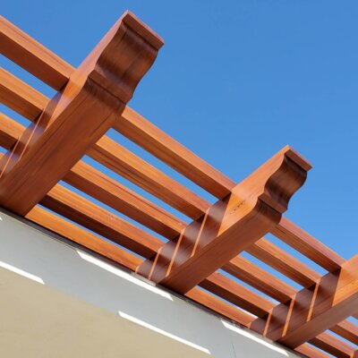 Wood Rafter Tails on Stained Trellis for Coastal Homes | HB